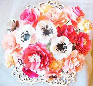 Various paper flowers like roses and peonies create a cheerful wedding bouquet that you can keep forever. 