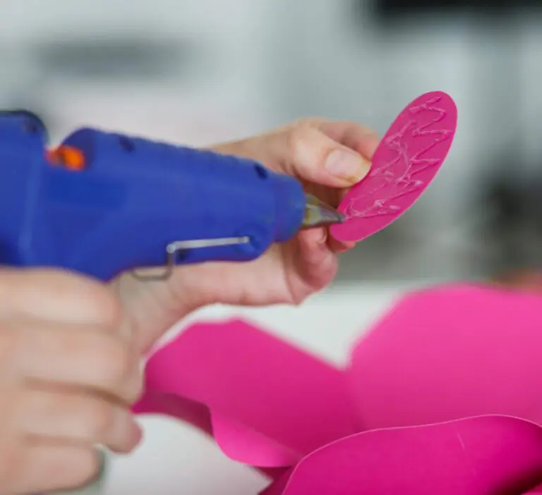 Someone gluing paper craft ideas