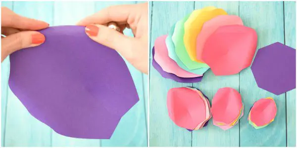 These two side-by-side photos show a close-up of Abbi Kirsten curling a large purple paper petal and a stack of rainbow petals already curled. These petals will be part of the Large rainbow flowers for the unicorn.