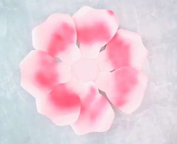 Seven ombre pink giant rose petals have been glued to the base of the Alora garden rose base. 