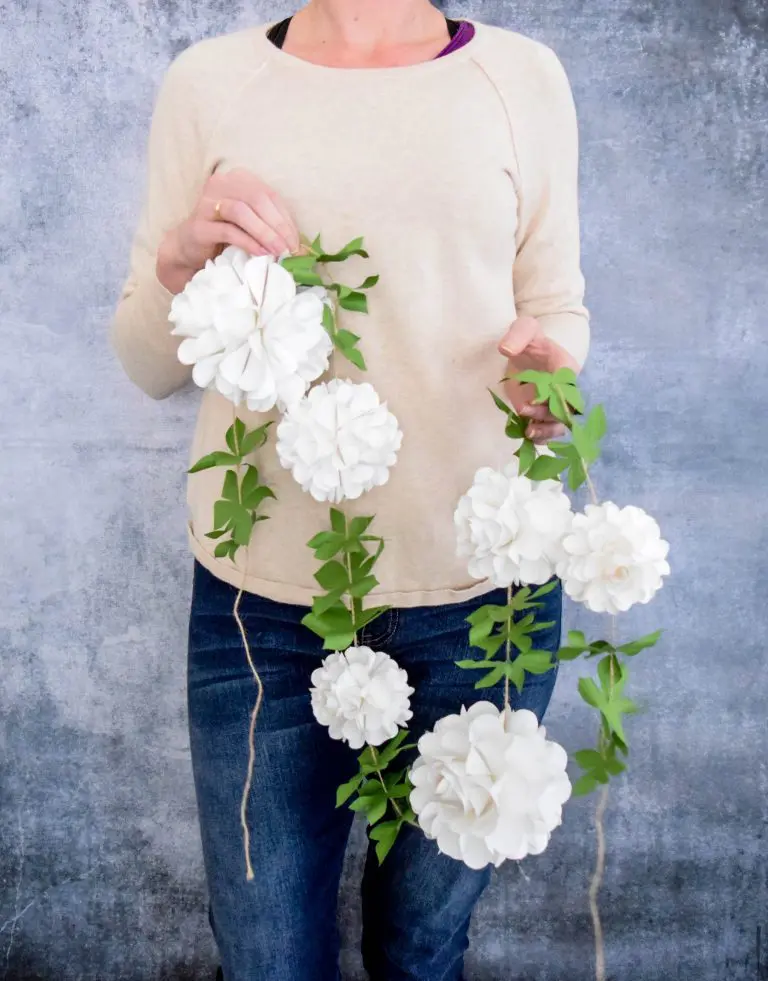 How to Make Paper Flower Balls. A step by step tutorial to create your own paper rose kissing balls to decorate your home, next party, wedding, or shower.