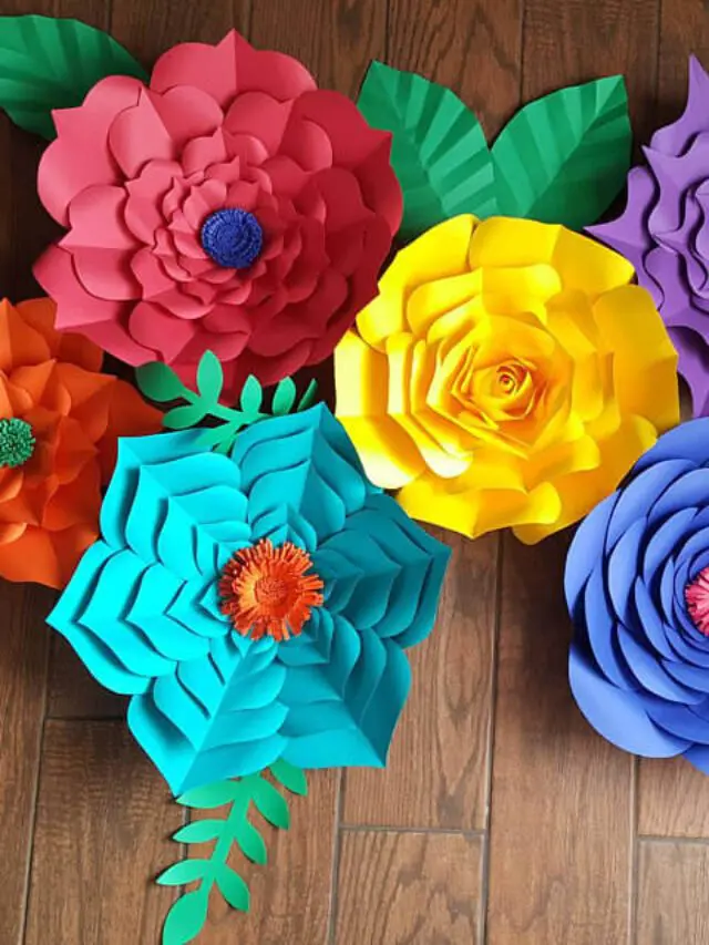 Giant paper flowers on a wooden background