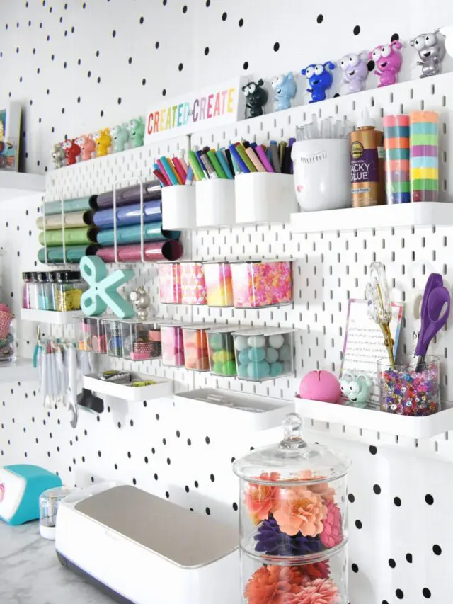 A polka-dot accented wall has more wall organizers to hold multiple craft supplies.