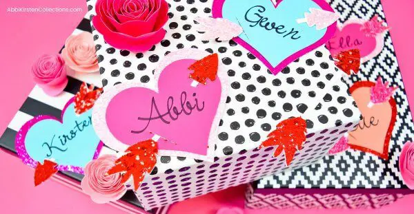 Personalized Valentine's Gift Tags attached to black and white graphic gift boxes. 