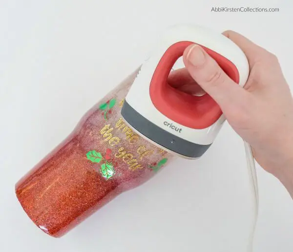 Cricut easypress mini to iron-on vinyl to tumblers.