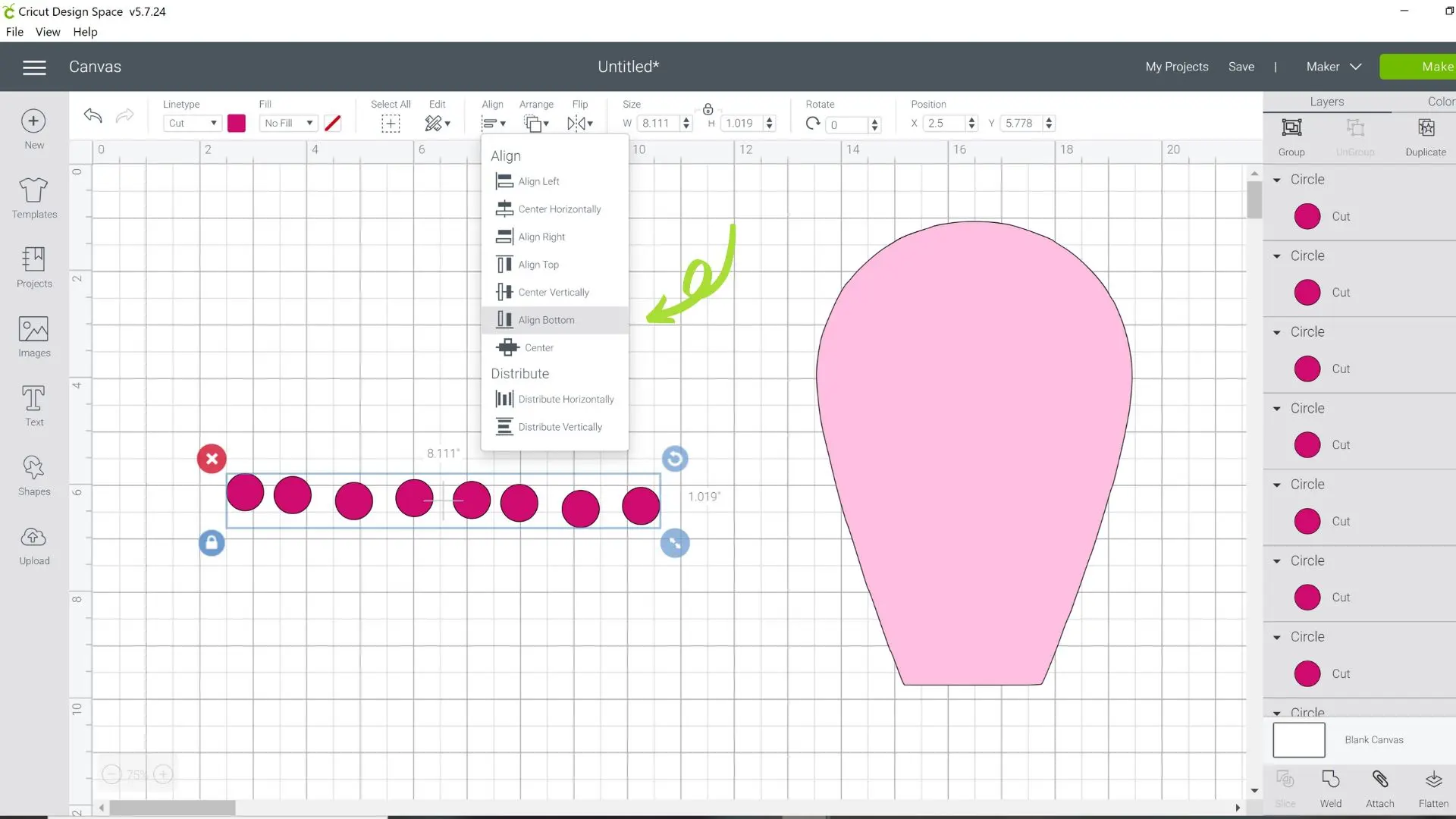 A screenshot of the Design Space canvas with small pink polka dots, a light pink flower petal. A drop-down menu has the "align bottom" option selected, with a small arrow pointing at the selection.