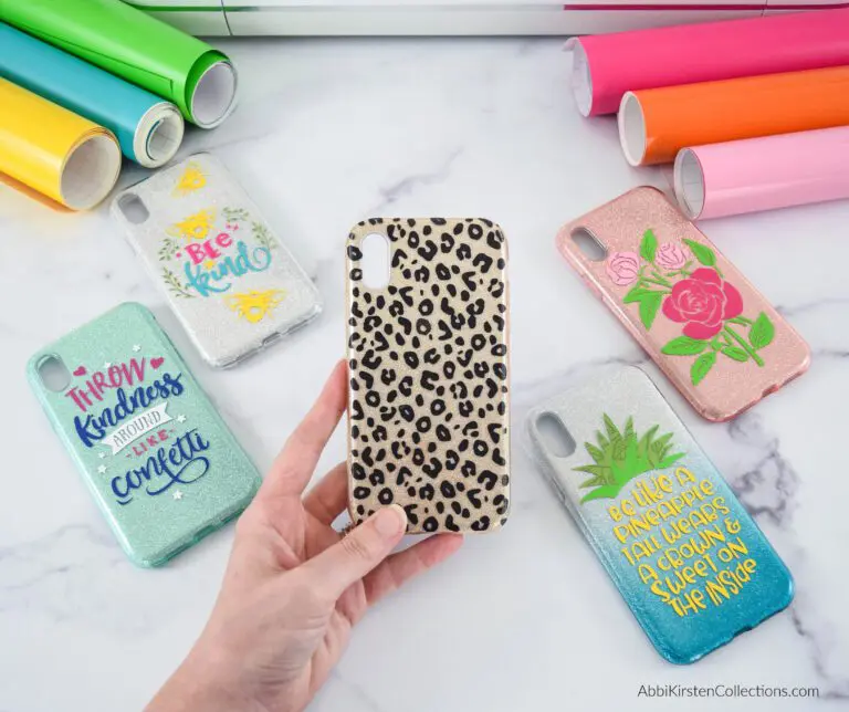 A hand holding an animal print phone case