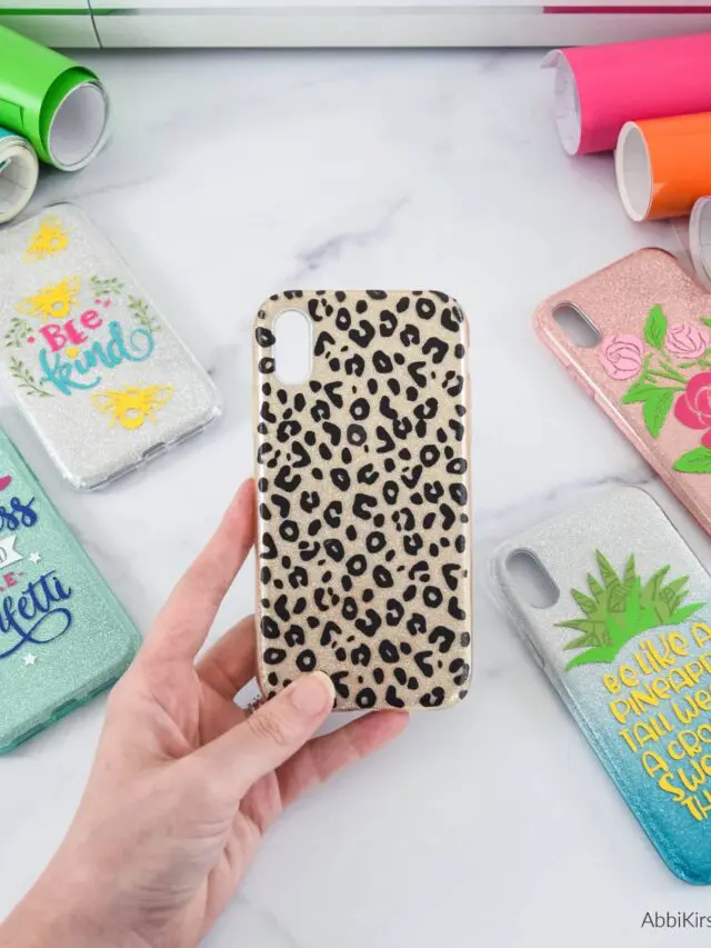 A hand holding an animal print phone case