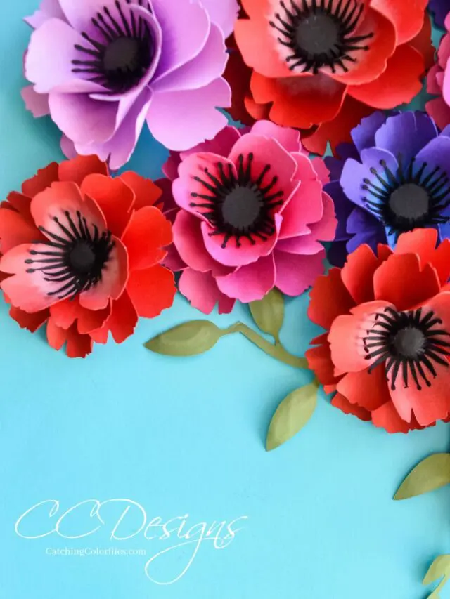 Paper poppies on a blue background