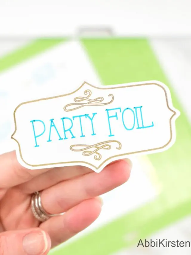 Focus photography on a hand holding a sticker with vinyl printing