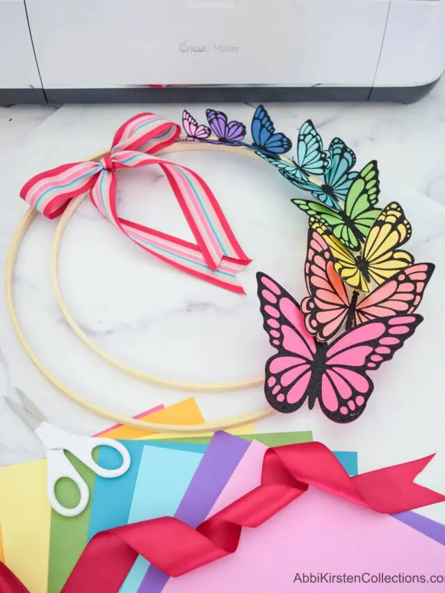 A colorful paper butterfly wreath made with cardstock butterflies.