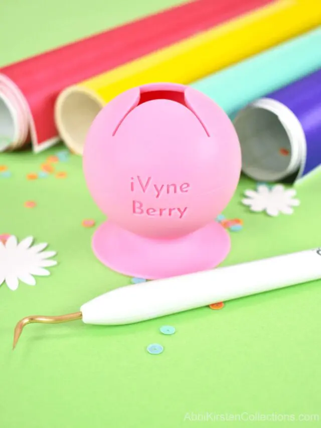 A pink nail polish holder turned into a scrap vinyl container