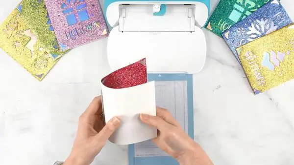 Writing on the inside of a card with the Cricut Joy mat.