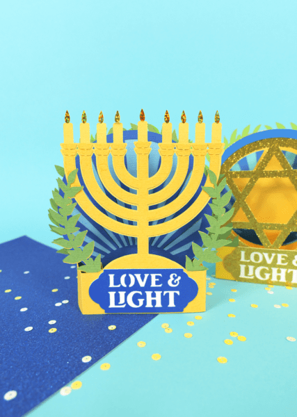 Pop up Hanukkah Menorah card made from blue, green and yellow cardstock. 