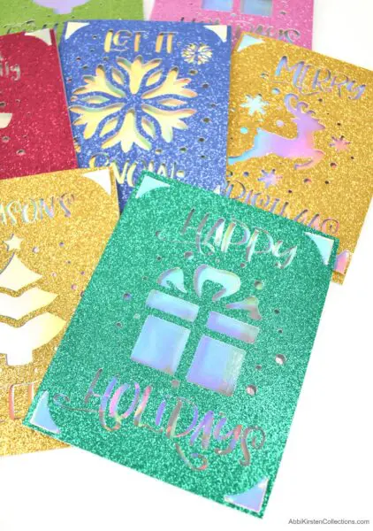 Learn how to make Christmas cards with your Cricut machine. Featuring the Cricut Joy machine use the card mat to make quick easy Christmas cards.