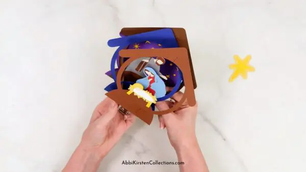 Assembling the Nativity christmas pop up card. 