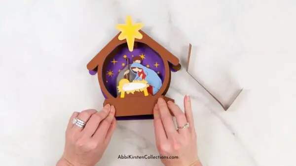 Assembling the Nativity christmas pop up card. 