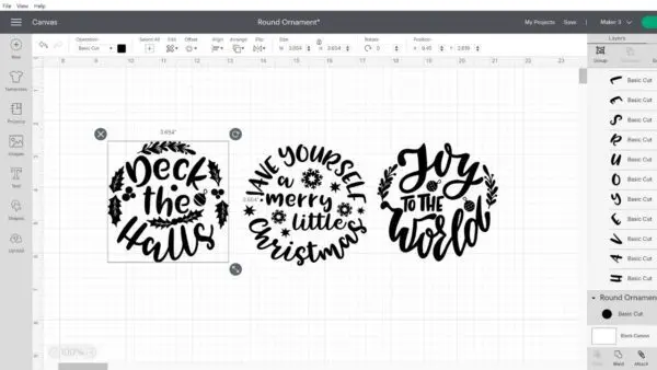 A screenshot of Cricut Design Space with three Christmas ornament decal designs on the design grid.