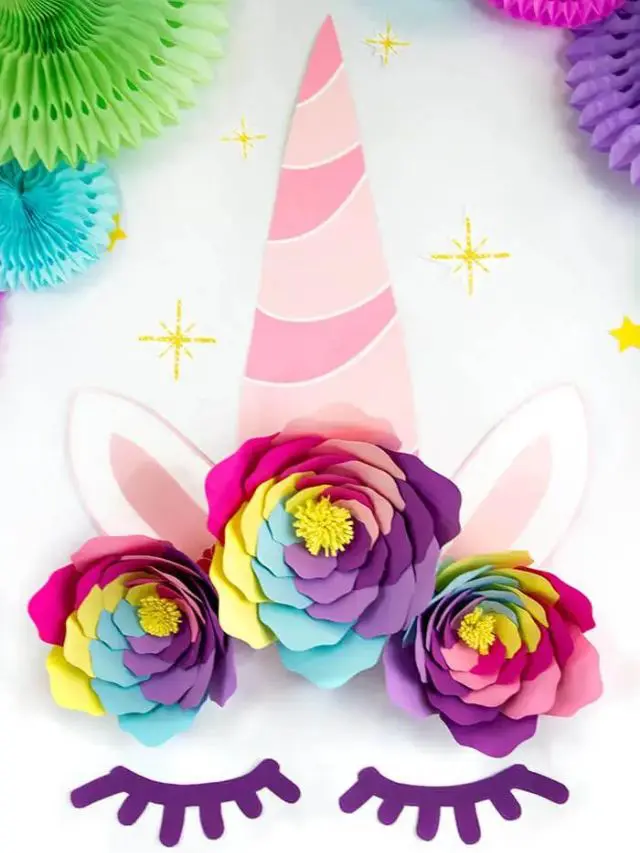 A paper unicorn decor with rainbow colored paper roses