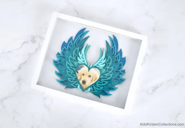 Memorial shadow box with angel wings for loss of a loved one.