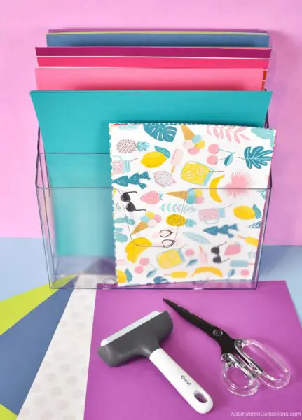 Clear plastic file holder for craft paper storage.