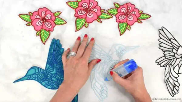 Layering paper crafts cut out with Cricut. 