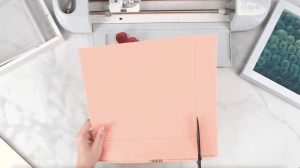 Cutting cardstock to cover the back of your shadow box.