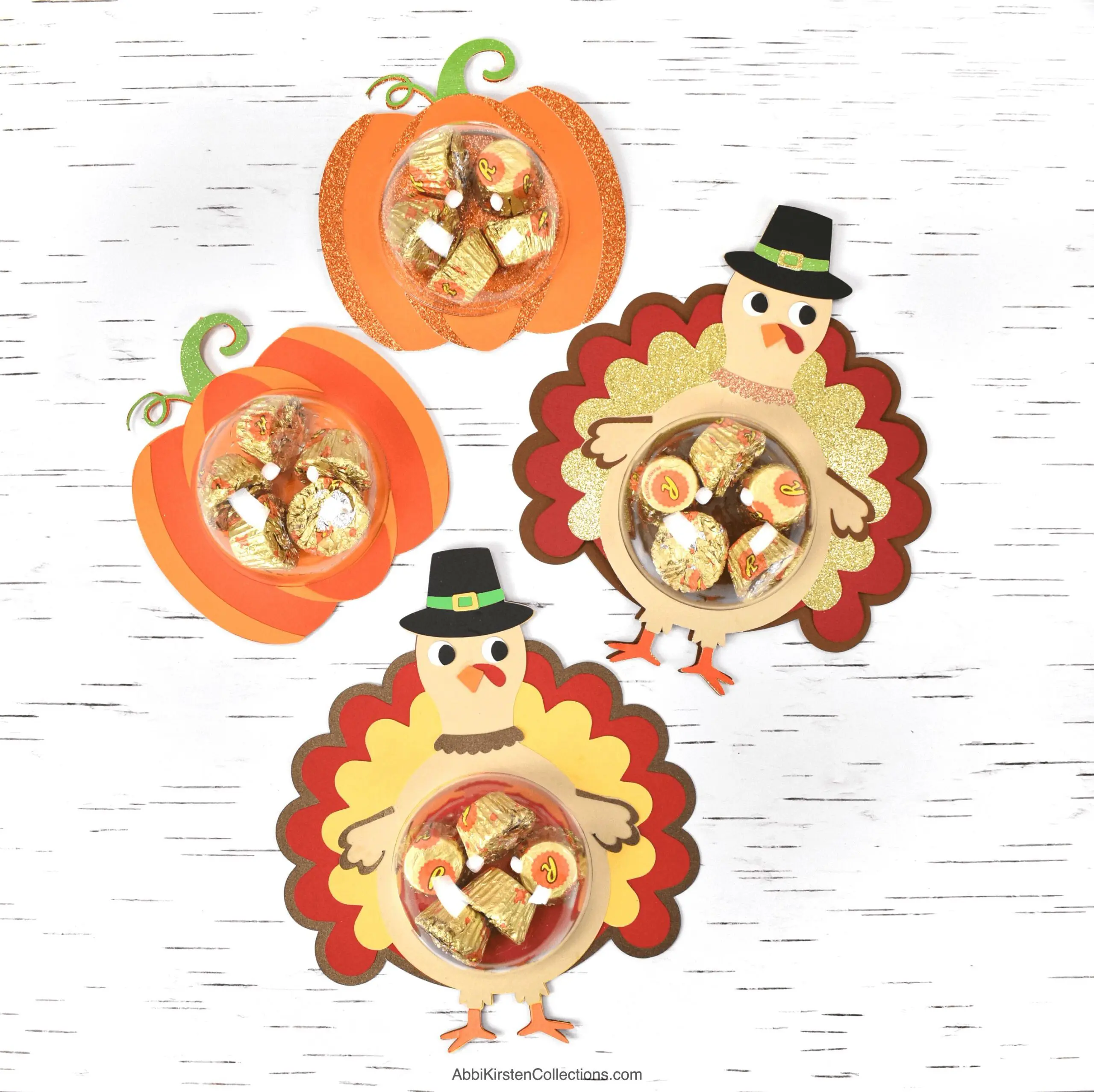 Flat lay photo of Thanksgiving themed candy holders in pumpkin and turkey designs