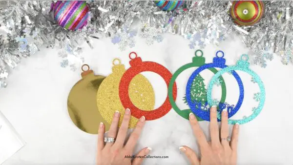 Image shows size layers of the Christmas tree paper ornament craft.