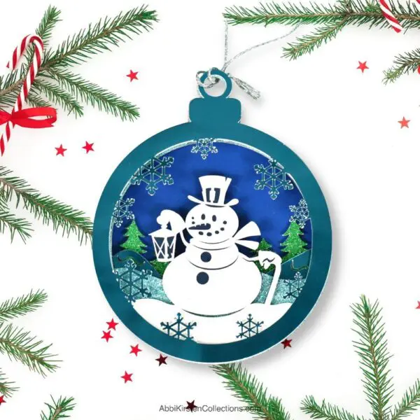 Snowflake and snowman paper Christmas ornament design with Cricut.