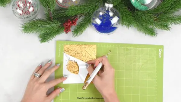 Hands weeding gold vinyl 