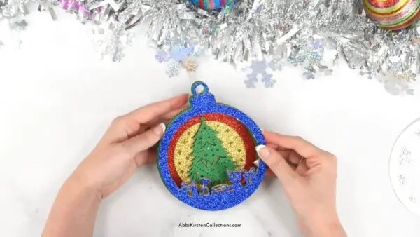 Image shows a Christmas tree ornament craft.