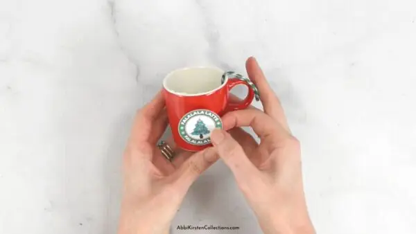 Apply Christmas sticker labels to the coffee ornaments.