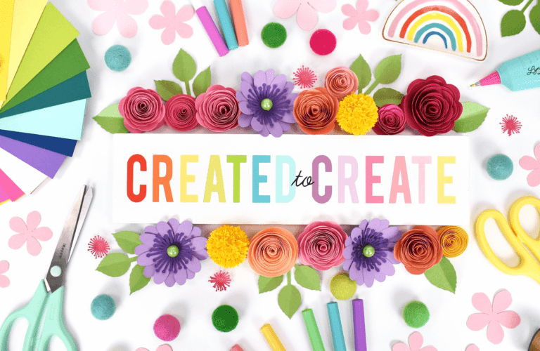 The image shows a desk full of bright and colorful craft supplies and cricut materials. The image is featured on the home page of Abbi Kirsten Collections