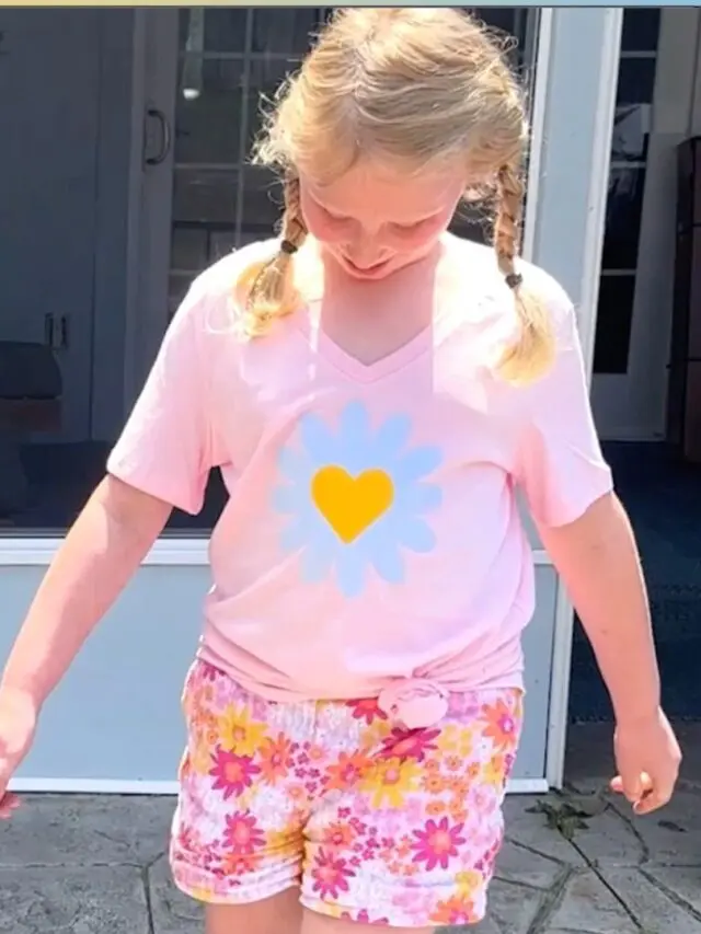 Little girl wearing color changing vinyl tshirt made with Cricut