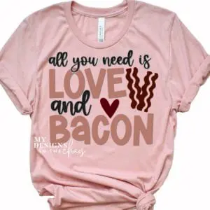 Coral-colored t-shirt with text All you need is love and bacon with heart and bacon slices