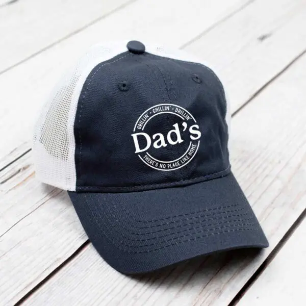 Gray ballcap with circle text Dad's grillin' chillin' drillin' there's no place like home.
