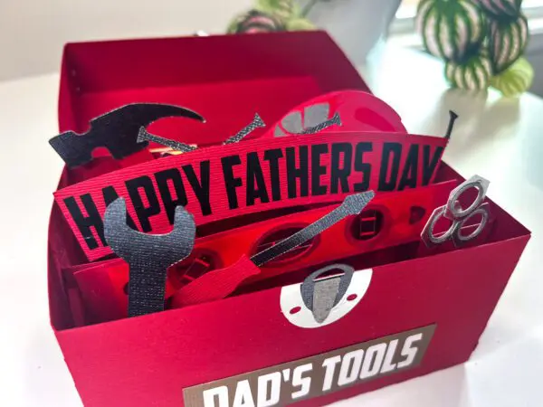 Free download of red paper craft toolbox with text cutout Happy Father's Day and Dad's Tools.