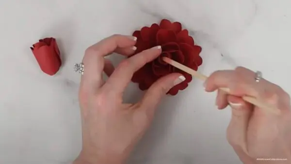 gluing center rosebud petal to flower for classic red rose
