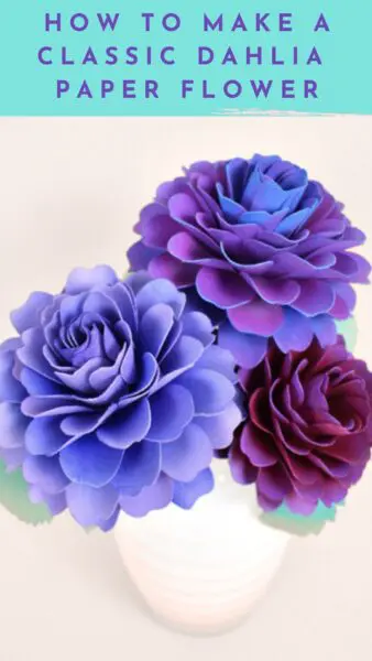 Bouquet of red and purple dahlia paper flowers in white vase