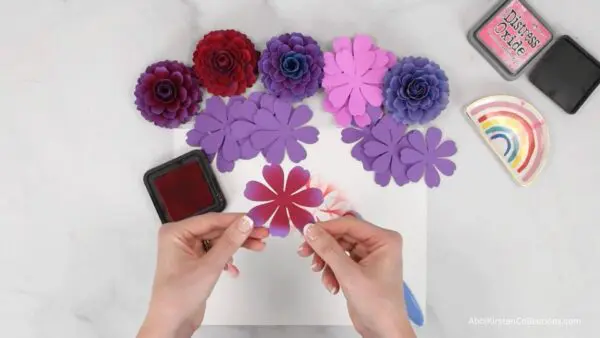 hands holding flower with distressed ink