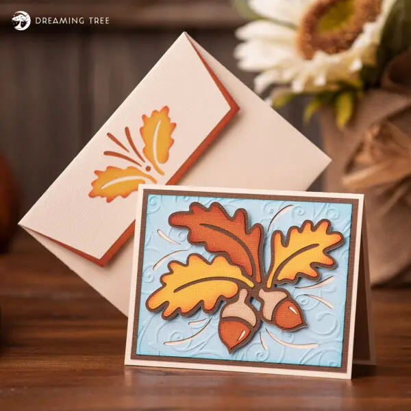 fall card with autumn leaves and acorns