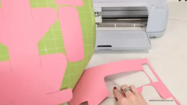 Pulling cardstock from Cricut mat for Valentine gift box template