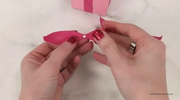 adding glue to bow loops for craft box