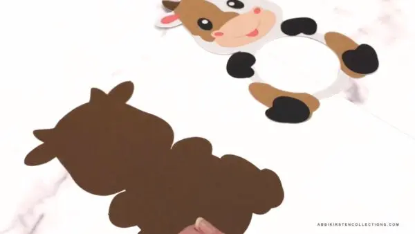 Front layer of cow cutout with all glued details and back layer