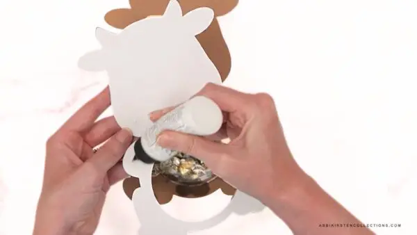 Adding glue to back of front farm animal cutout