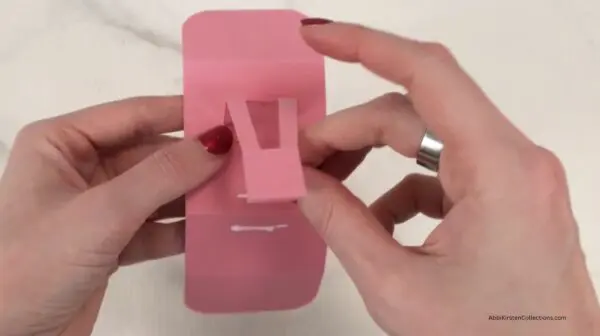 gluing popup piece to 3 score lines on rectangle for surprise gift box