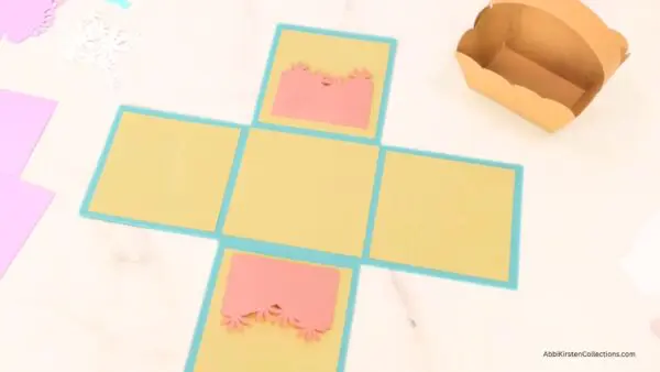 Pink pockets glued to inside of box