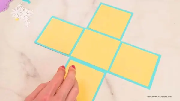 Yellow cardstock is glued to inside of basket