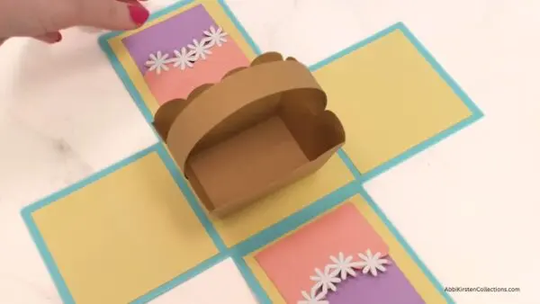 Paper Easter basket glued to center of treat box